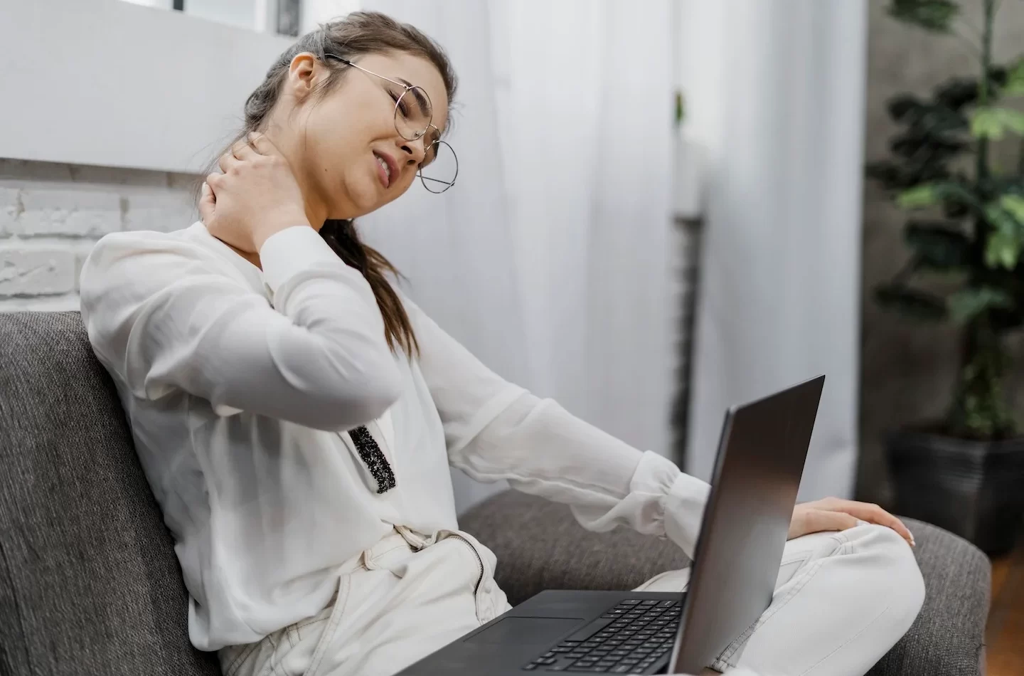 woman-having-neckache-as-she-works-home